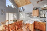 Knotty Pine Chalet kitchen with stainless steel appliances. 